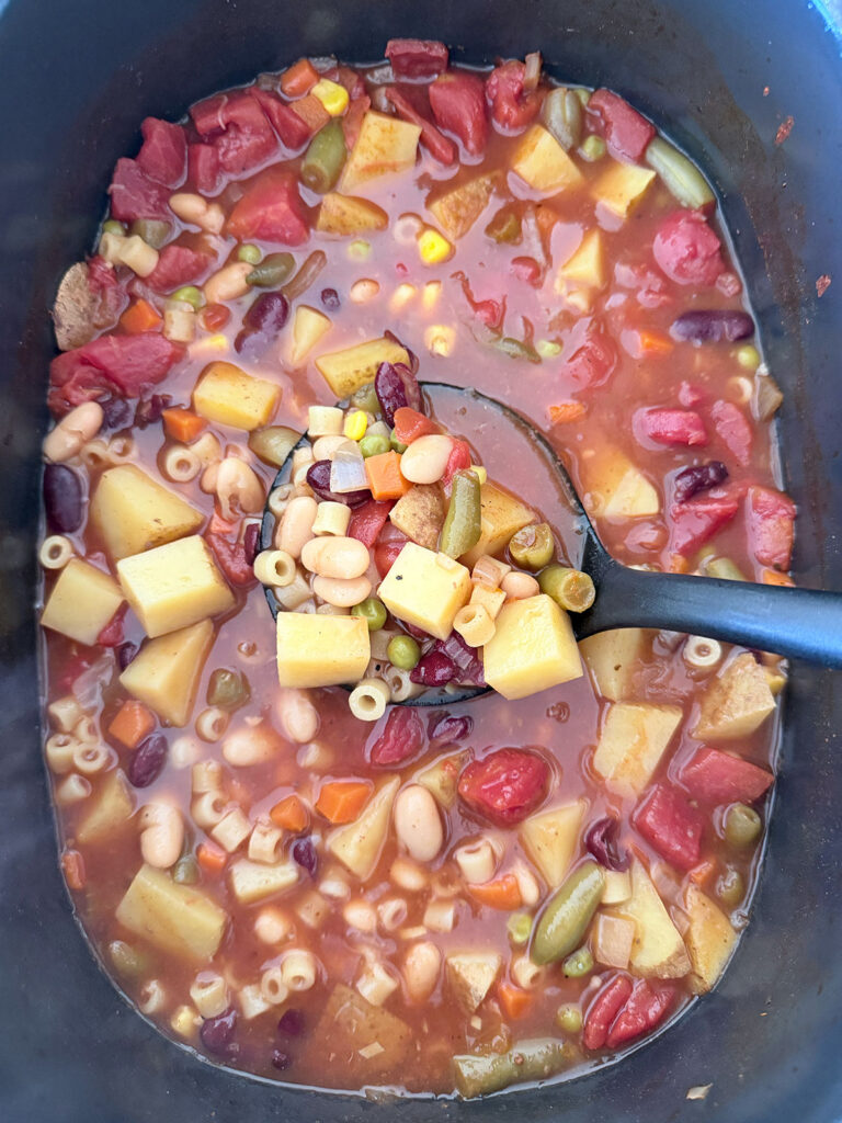 crockpot minestrone in crockpot with ladle