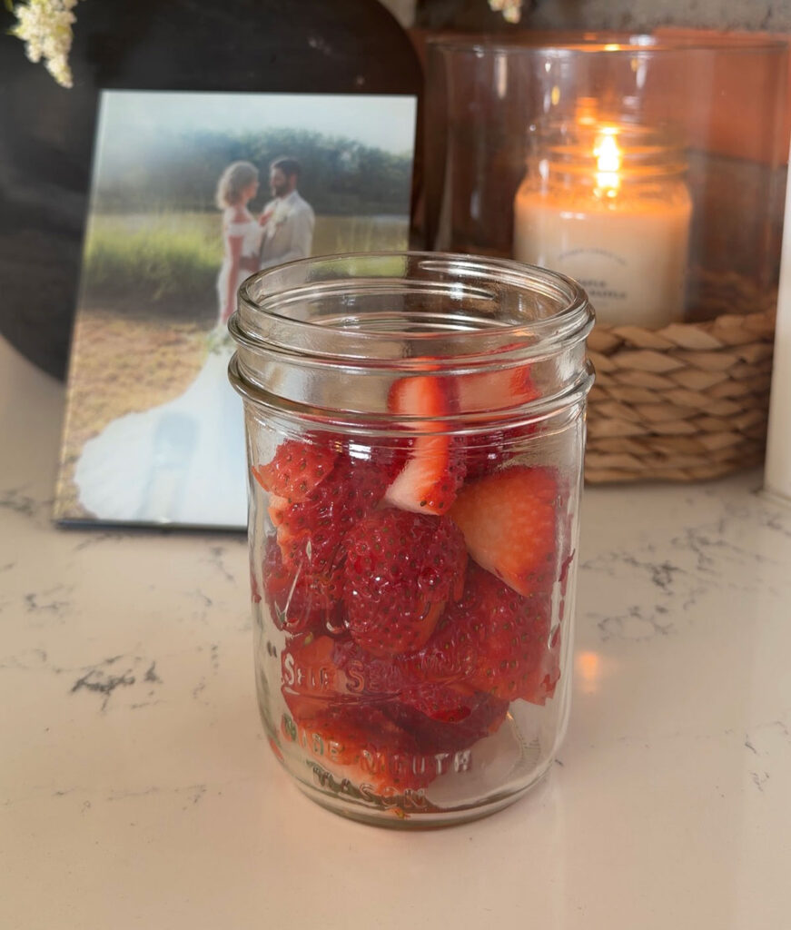 glass jar with sliced strawberries