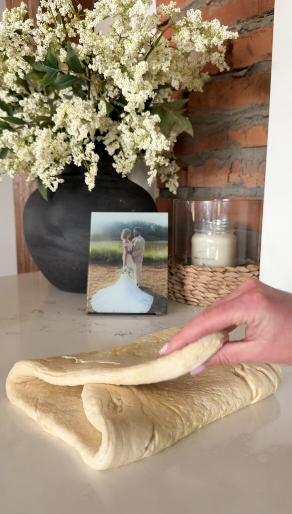 folding each end of the dough.
