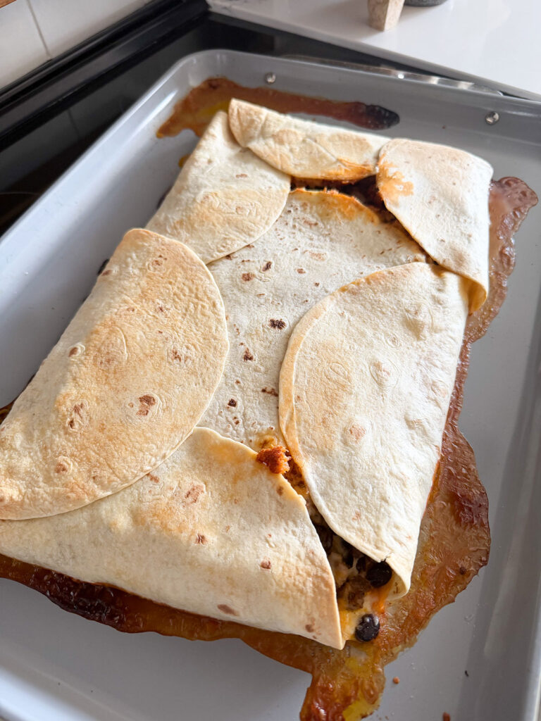 finished and baked sheet pan quesadilla on sheet tray