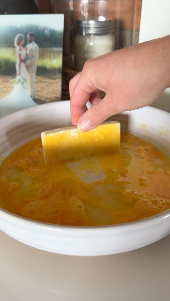 putting the cheese in the egg batter