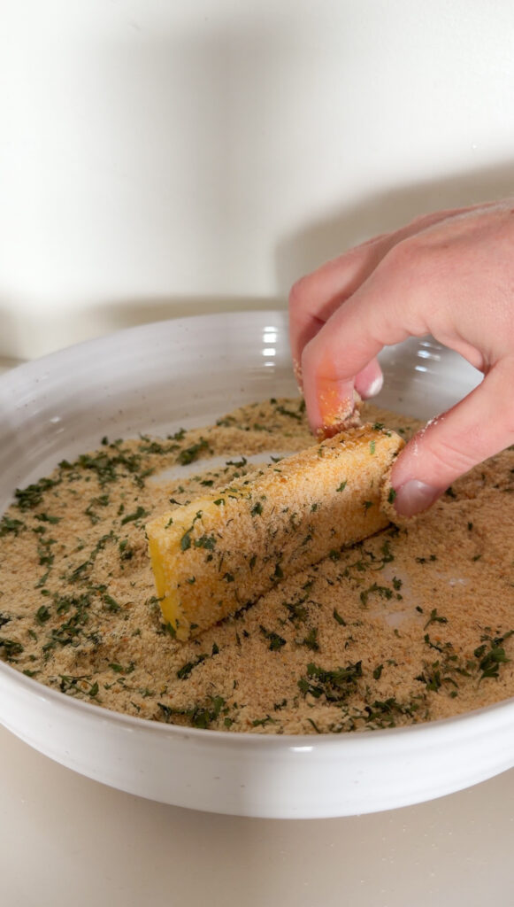 putting the cheese in the breadcrumbs