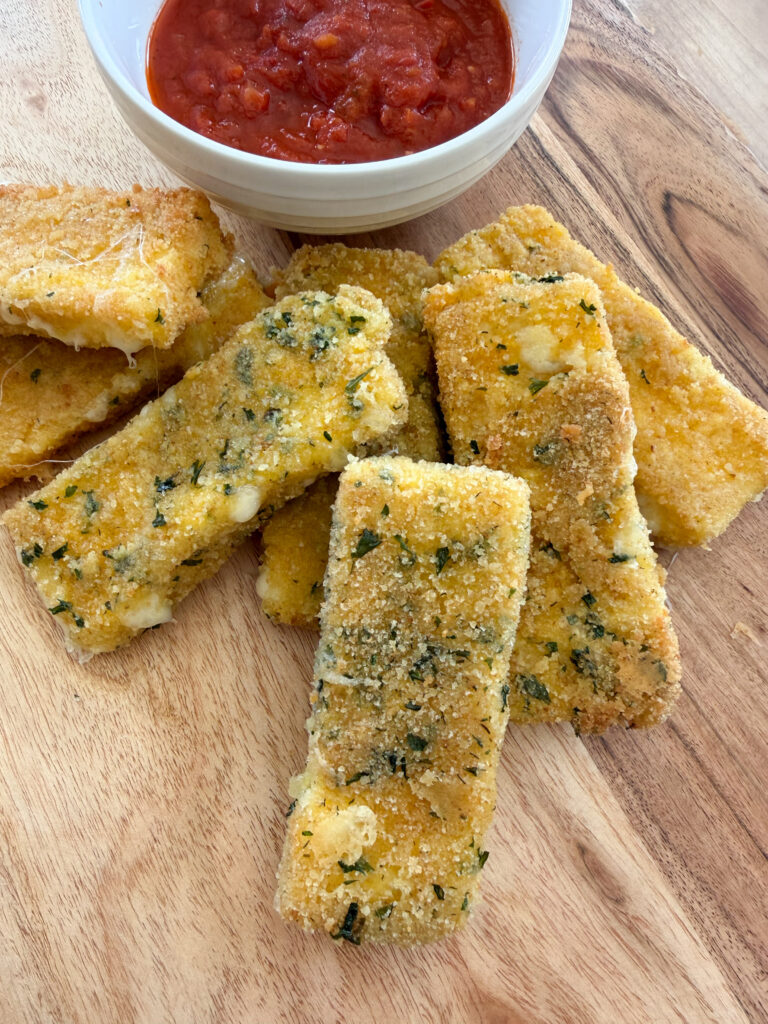 mozzarella sticks all together with marinara sauce