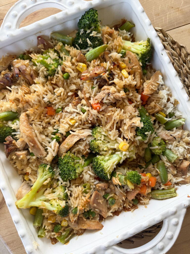 chicken teriyaki casserole in white baking dish