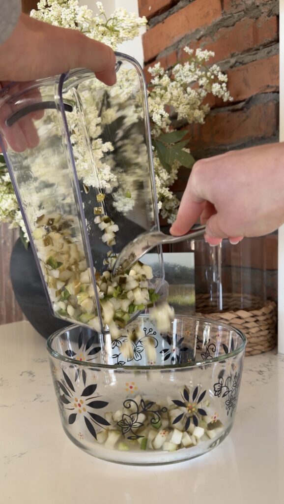 adding chopped ingredients to bowl