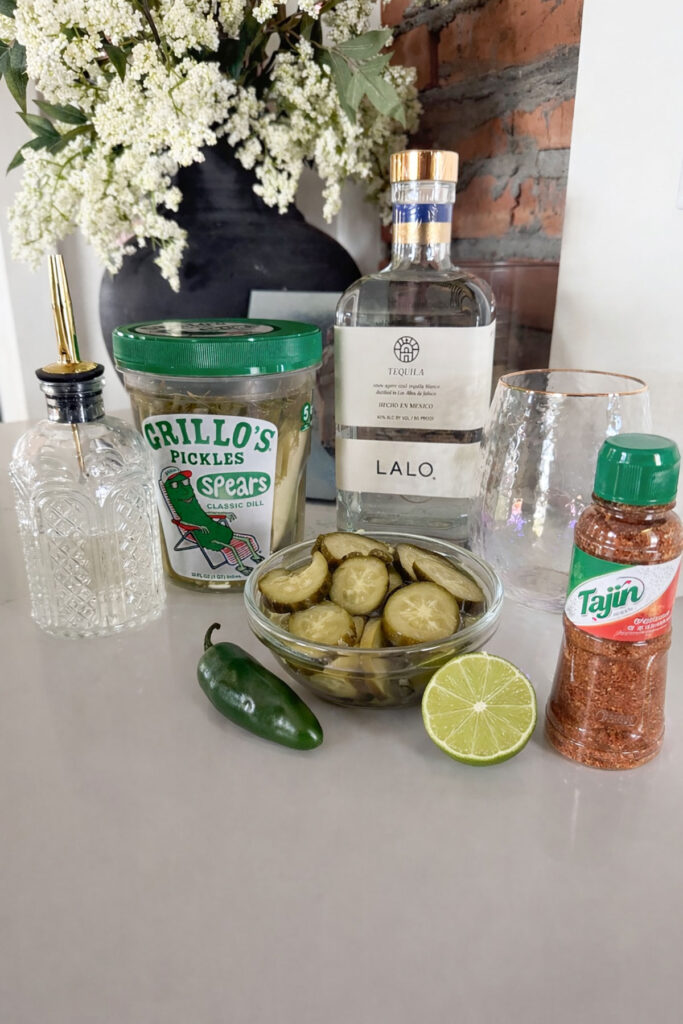 pickle margarita ingredients on counter
