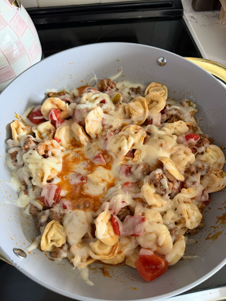 taco tortellini in pan with melted cheese on top