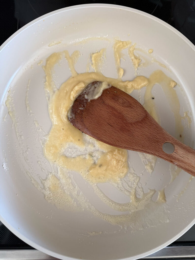 wooden spoon stirring flour and butter together