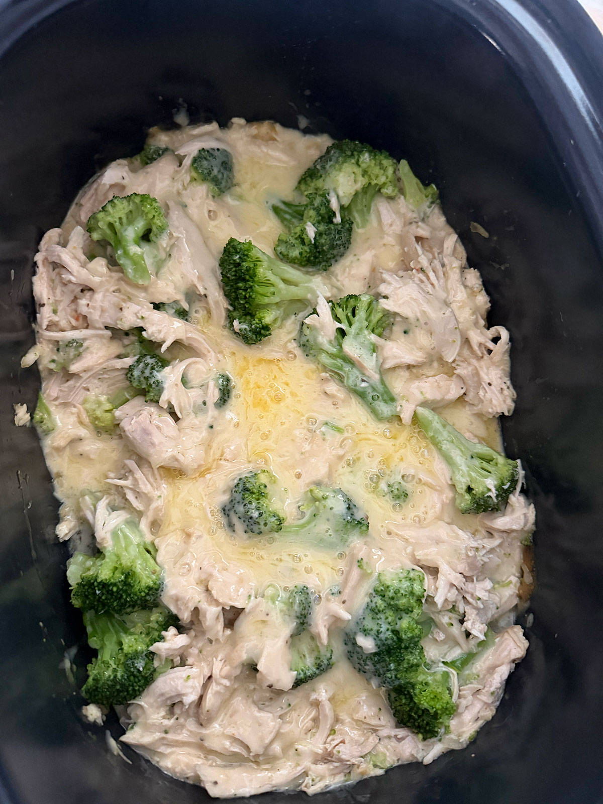 cooked chicken divan mixture in base of crockpot