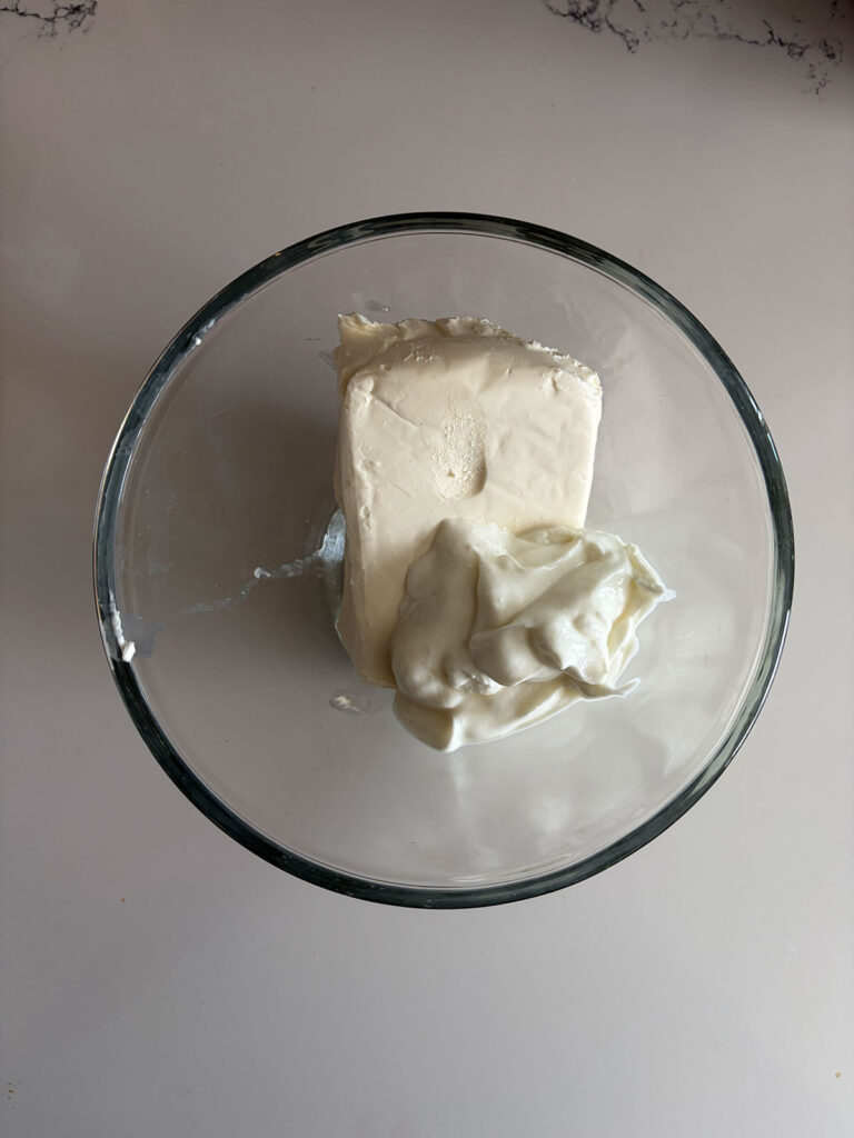 cream cheese and mayonnaise in clear bowl