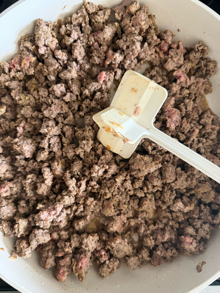 ground beef browning and crumbled in pan