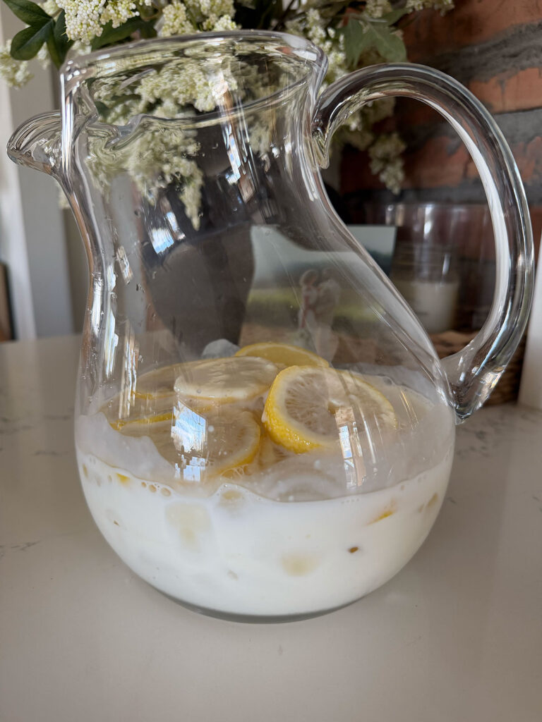 clear pitcher with creamy lemonade