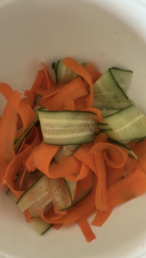 cucumber and carrots in a bowl