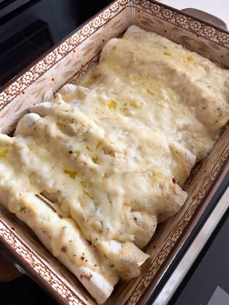 Baked white chicken enchiladas.