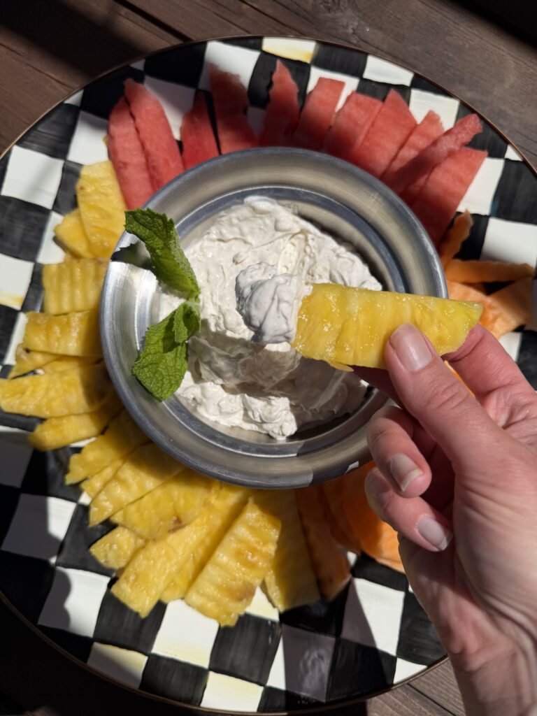 dipping pineapple in dip