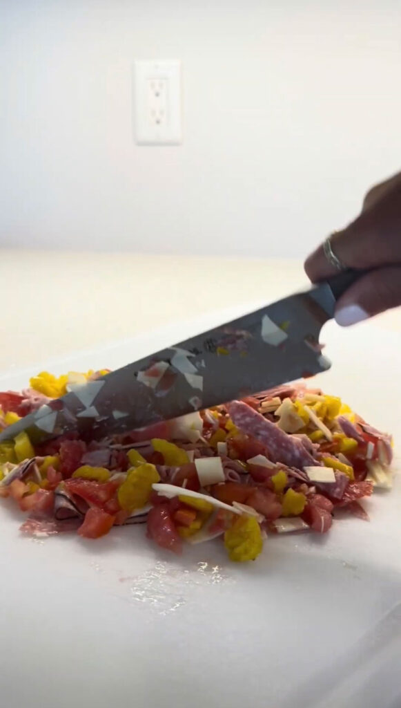 Chopping the filling for Italian sliders.