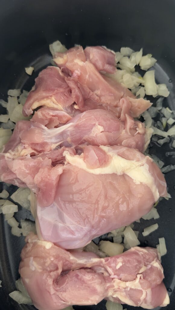 chicken on top of diced onions