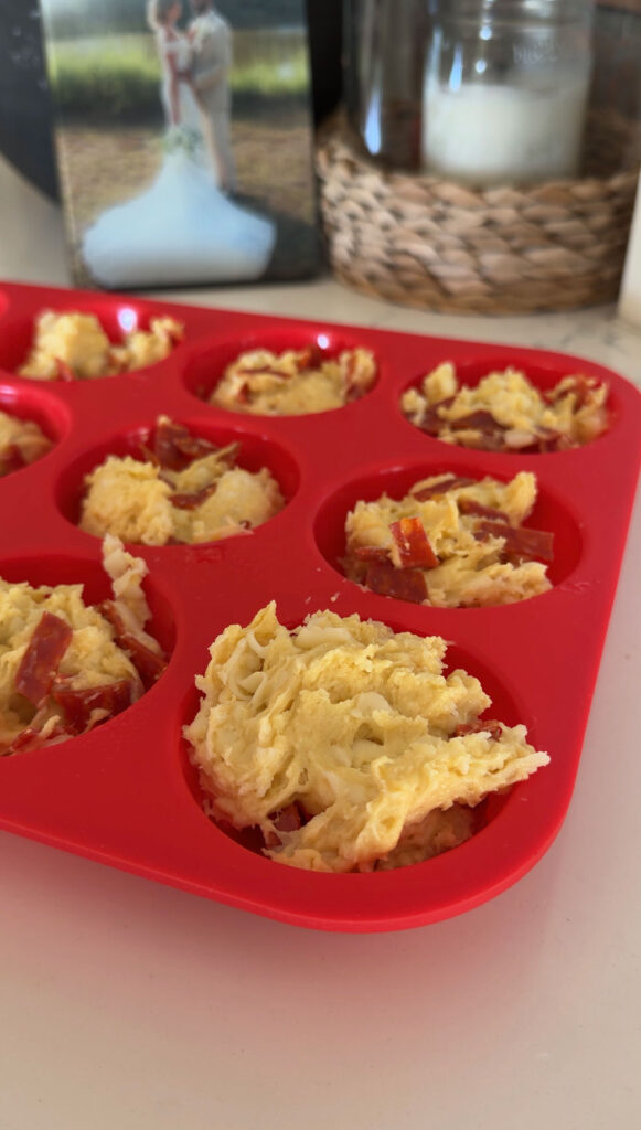 unbaked pizza muffins in red silicone muffin tray