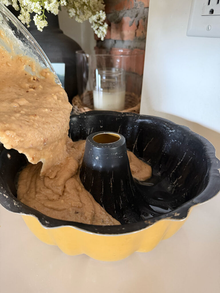 cake batter going into bundt pan