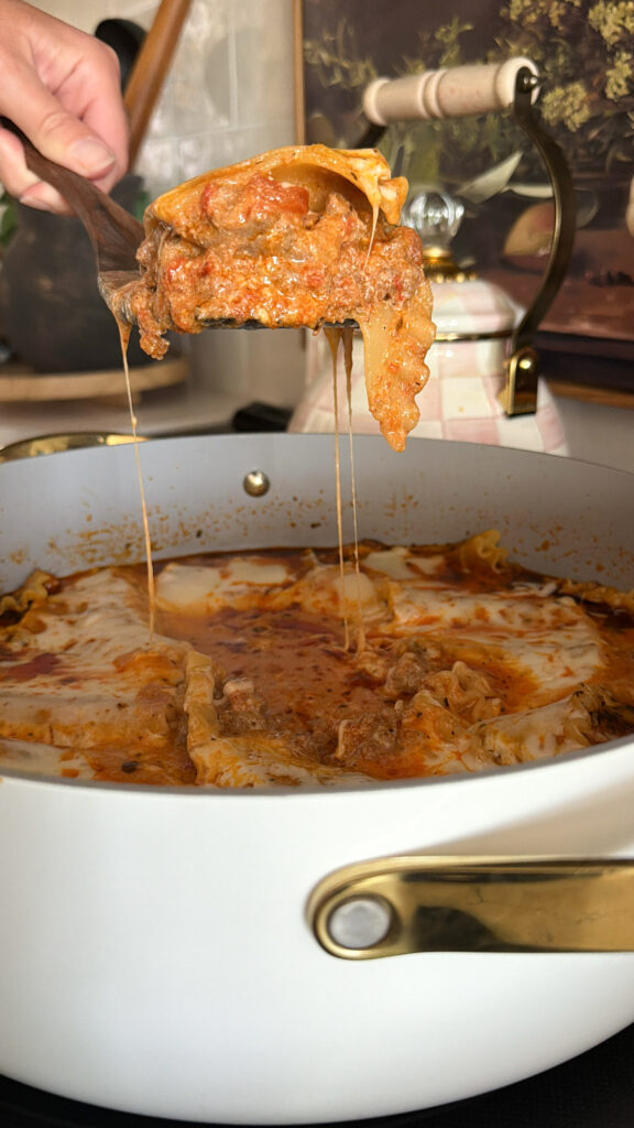 lasagna being spooned out of pan
