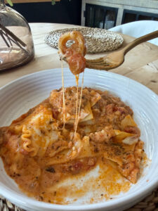 cheesy lasagna on fork