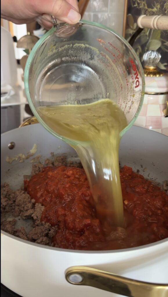 pouring in the sauce and broth