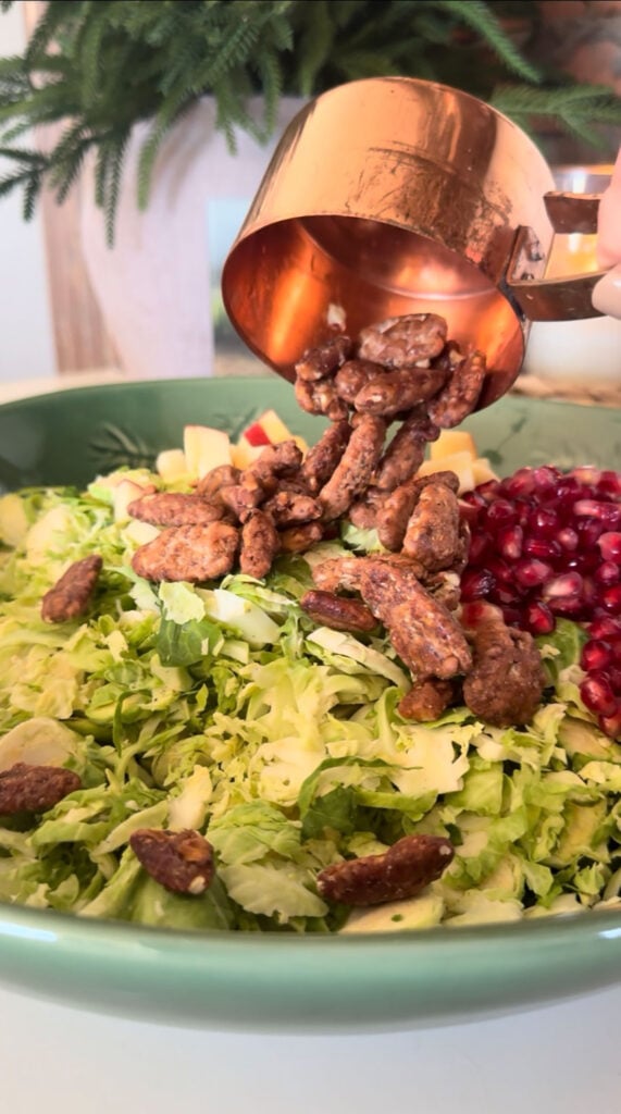 nuts being added to salad
