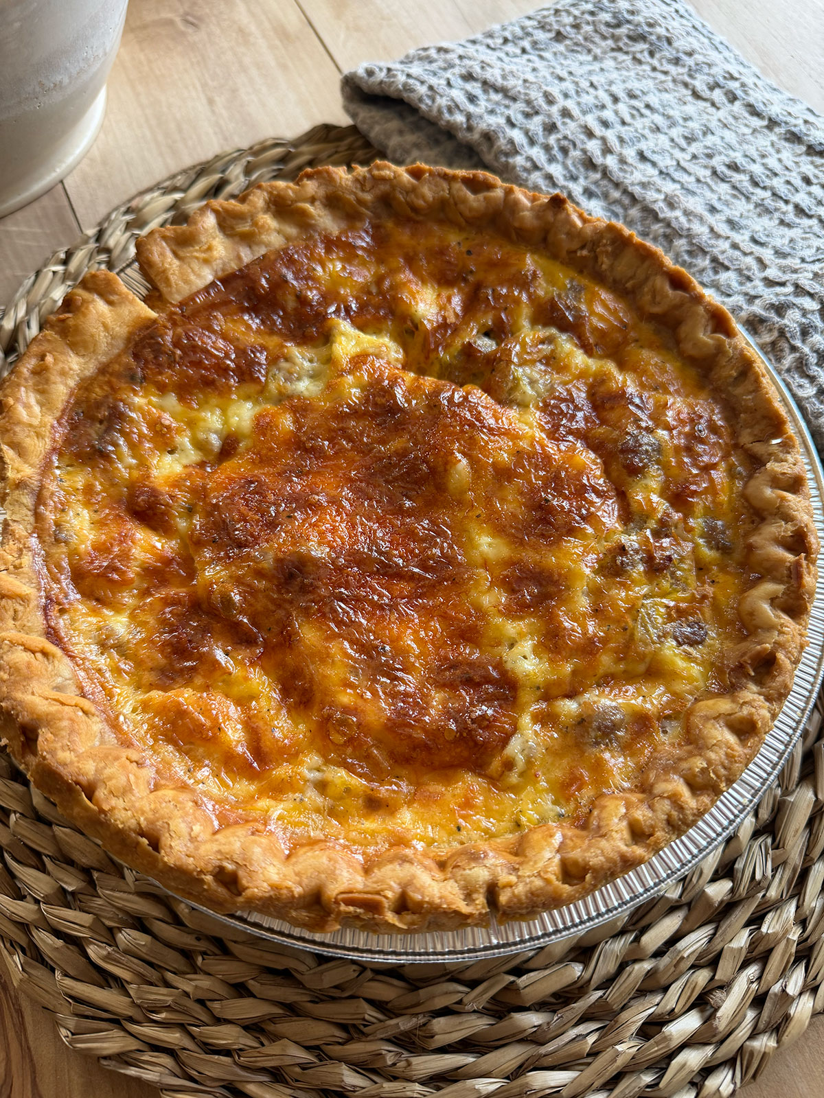 whole baked quiche on placemat