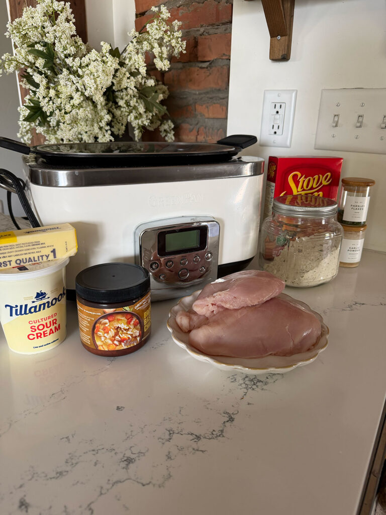 crockpot chicken and stuffing ingredients with slow cooker on counter