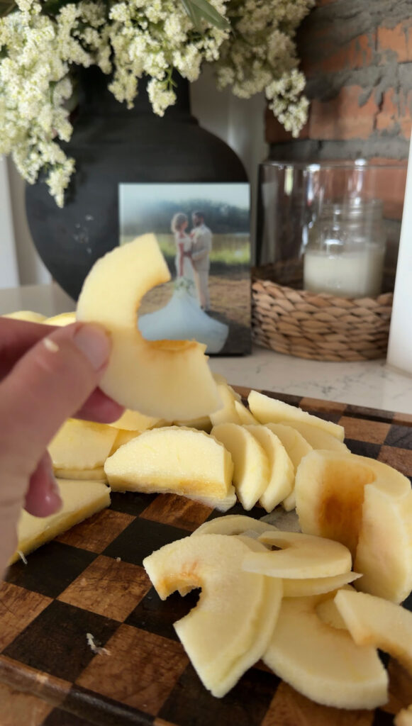 sliced apples held up by hand