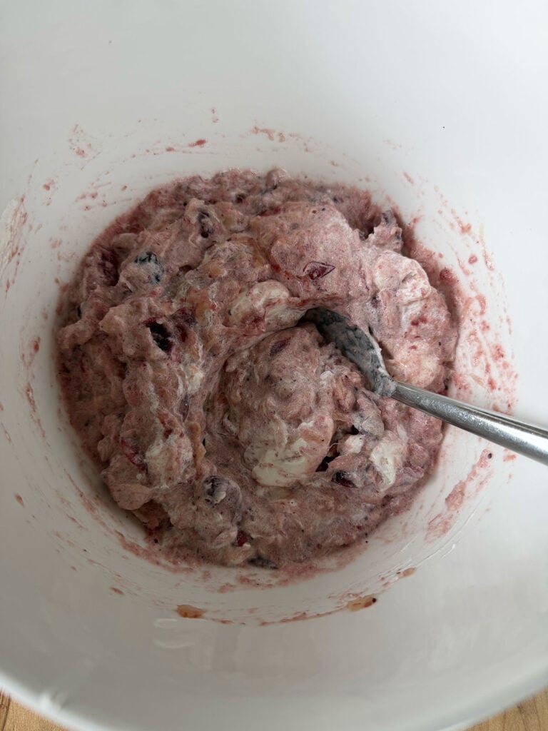 cranberry mixture in white bowl with spoon