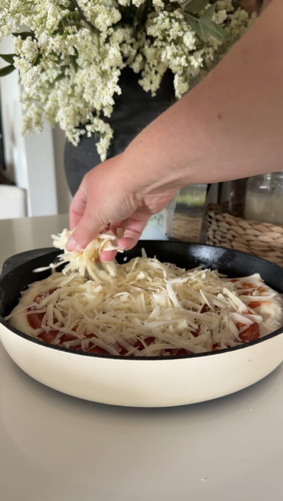 topped with sauce and cheese