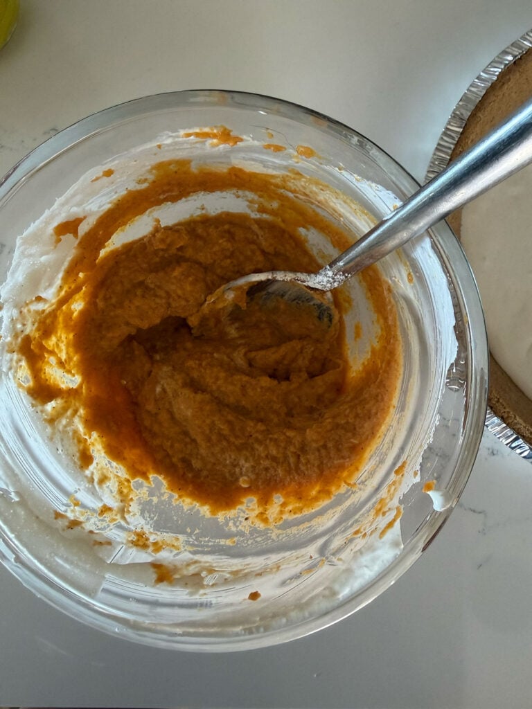 pumpkin filling in clear bowl with spoon