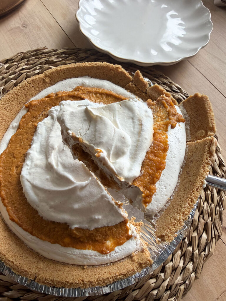 no bake pumpkin pie with cut slice being removed