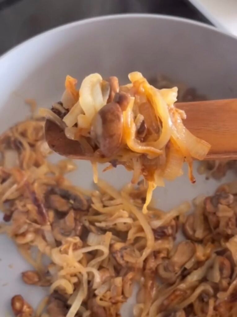 caramelized onions on wooden spoon