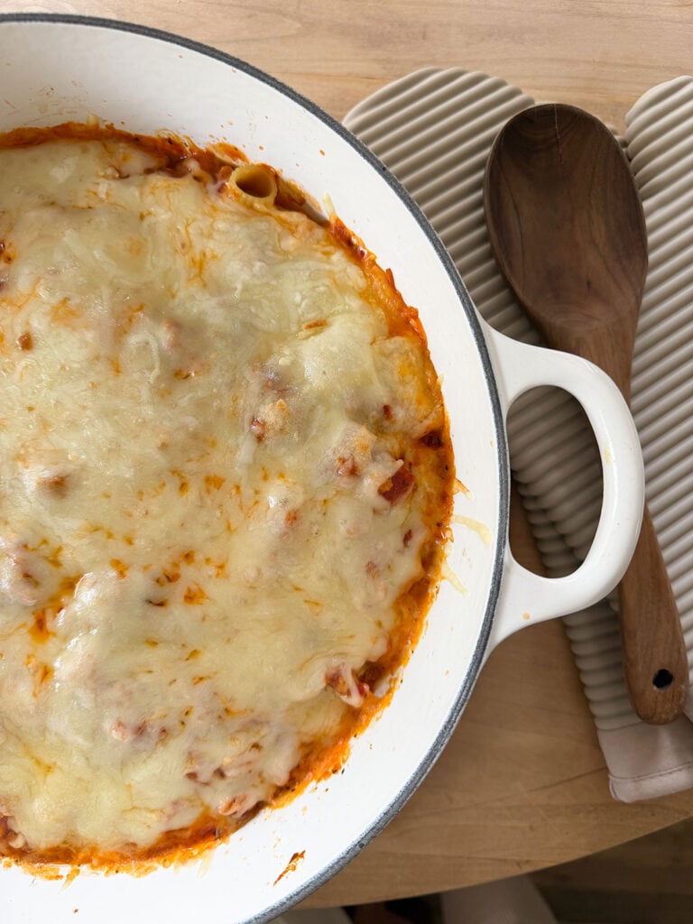 Baked rigatoni in a white pot.