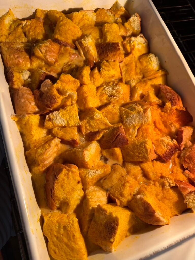 Overhead of soaked pumpkin french toast casserole before baking.